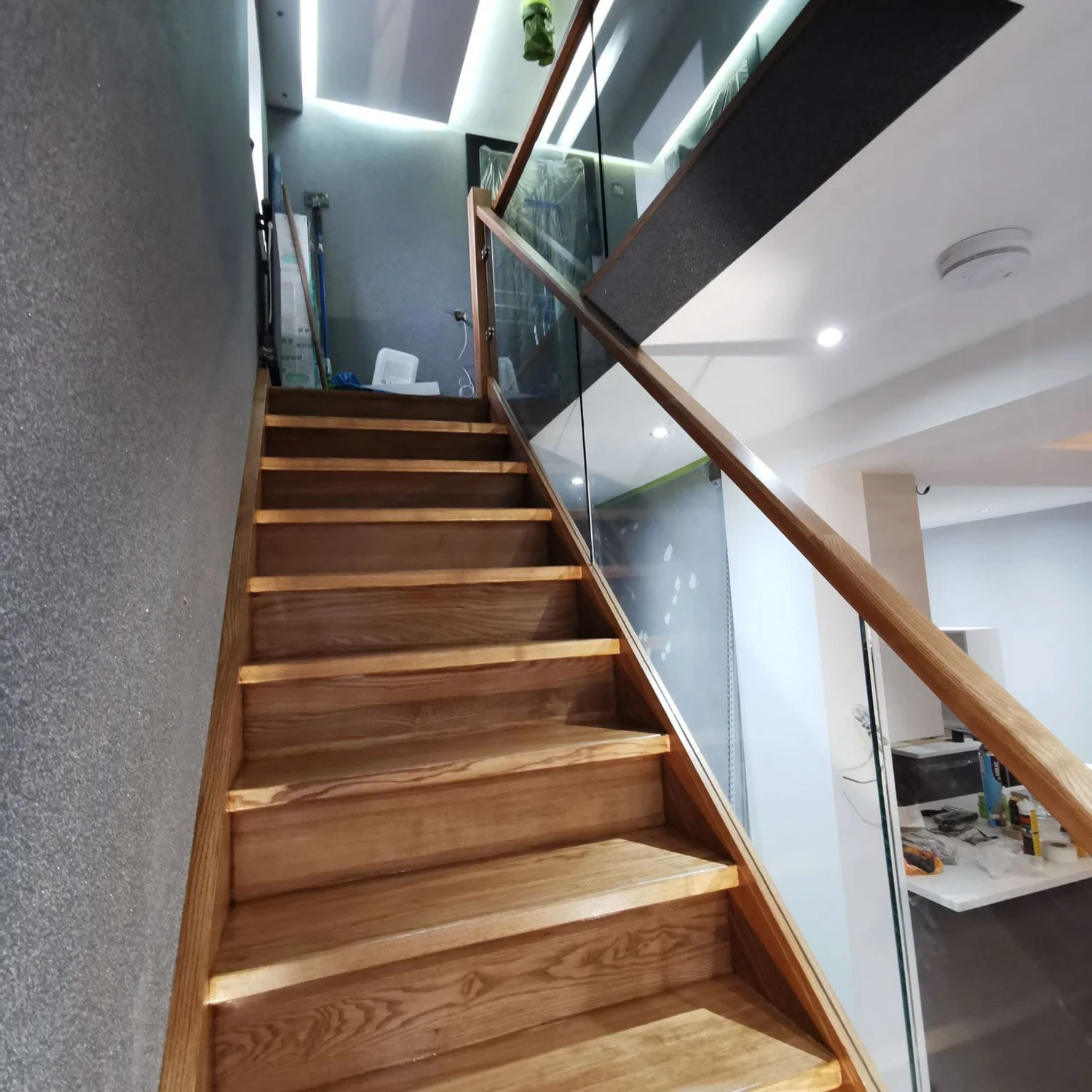 Timber staircase with glass balustrade